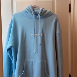 Baby blue You Matter hoodie. By Demetrius Harmon
